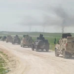 ارتال الجيش السوري لدى دخولها لأخر قاعدة (أ ف ب)