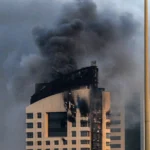الدخان يتصاعد من مبنى بعد هجوم إيراني سابق على الكويت(أ ف ب)