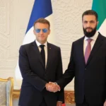 الشرع لدى استقباله ماكرون في دمشق (أ ف ب)