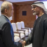 ولي عهد أبوظبي والرئيس الإيراني خلال لقائهما على هامش قمة "بريكس "في الهند (إكس)