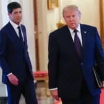 كيفن وارش والرئيس الأمريكي دونالد ترامب (أ ف ب)