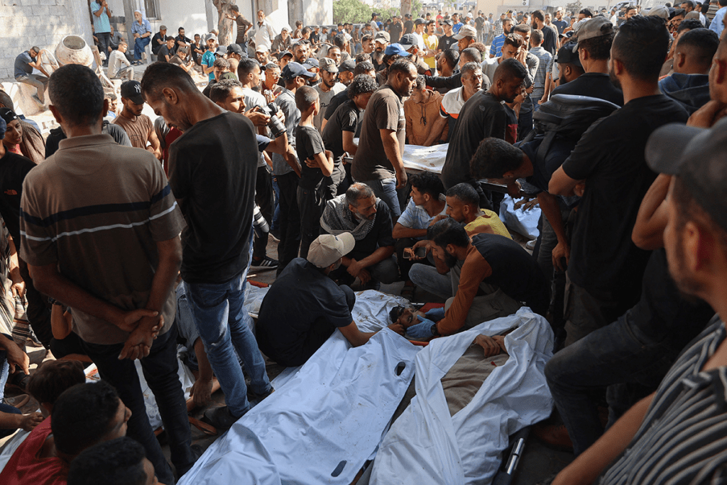 Mourners gather during the funeral of Palestinians, killed the night before in an Israeli strike, in Gaza on July 29, 2025. AFP