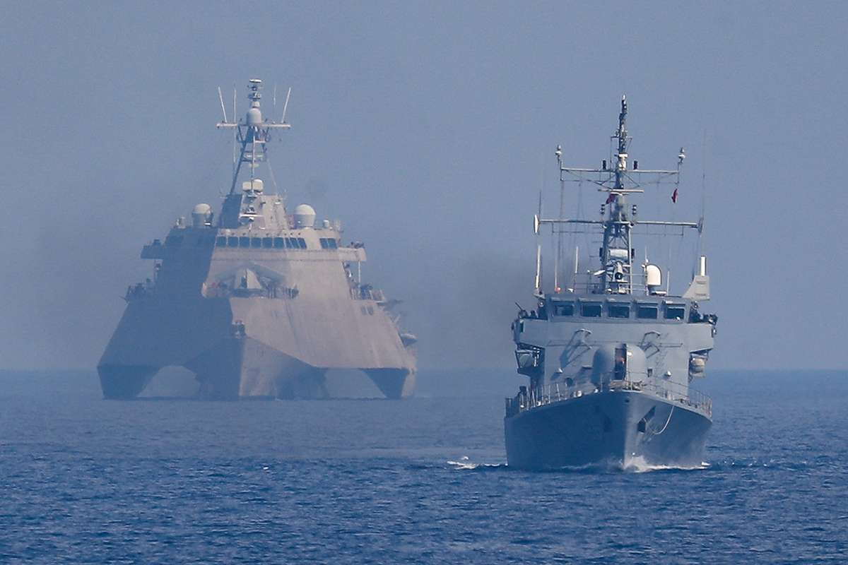 A maneuver involving a U.S. warship and a Philippine vessel in the West Philippine Sea on April 25, 2025. AFP