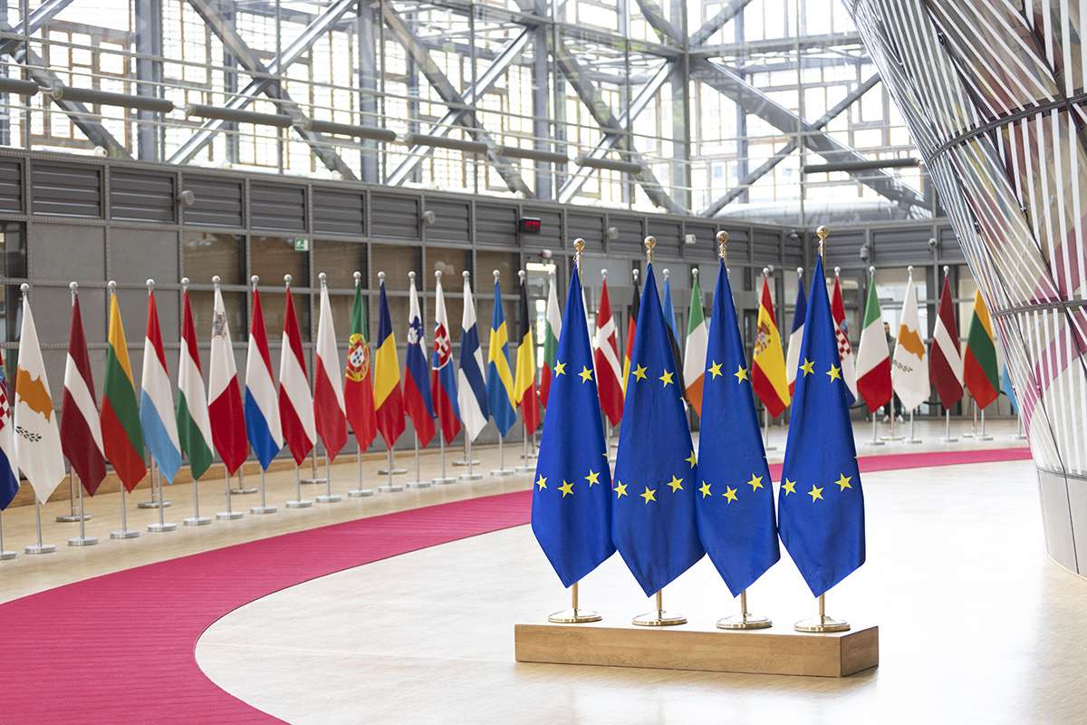EU flags from the countries member states and the flag of Europe on poles in Europa Building. AFP