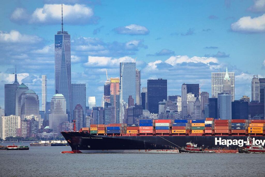 Large container ship with import products enters port in New York