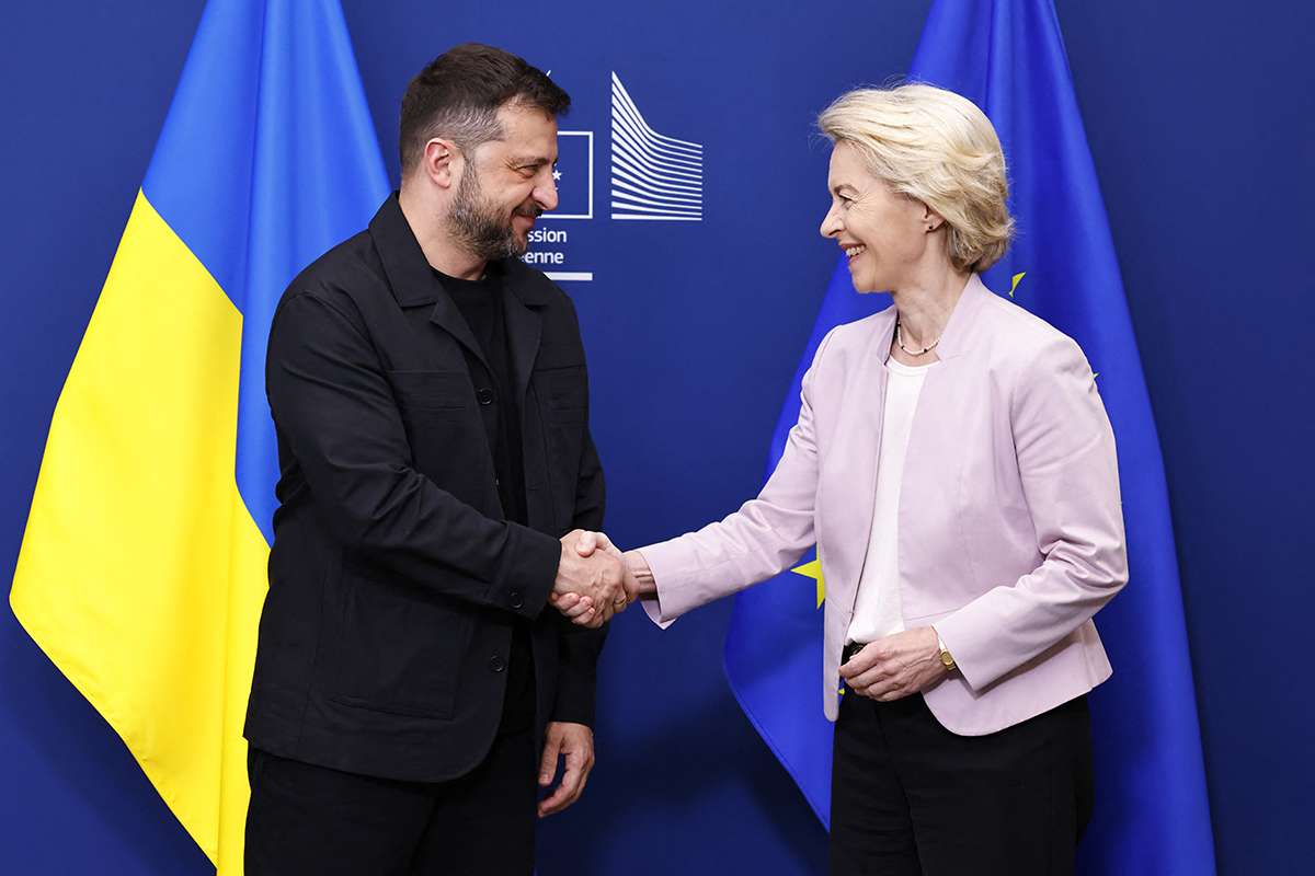 Ursula Von der Leyen shakes hands with Volodymyr Zelensky in Brussels. AFP