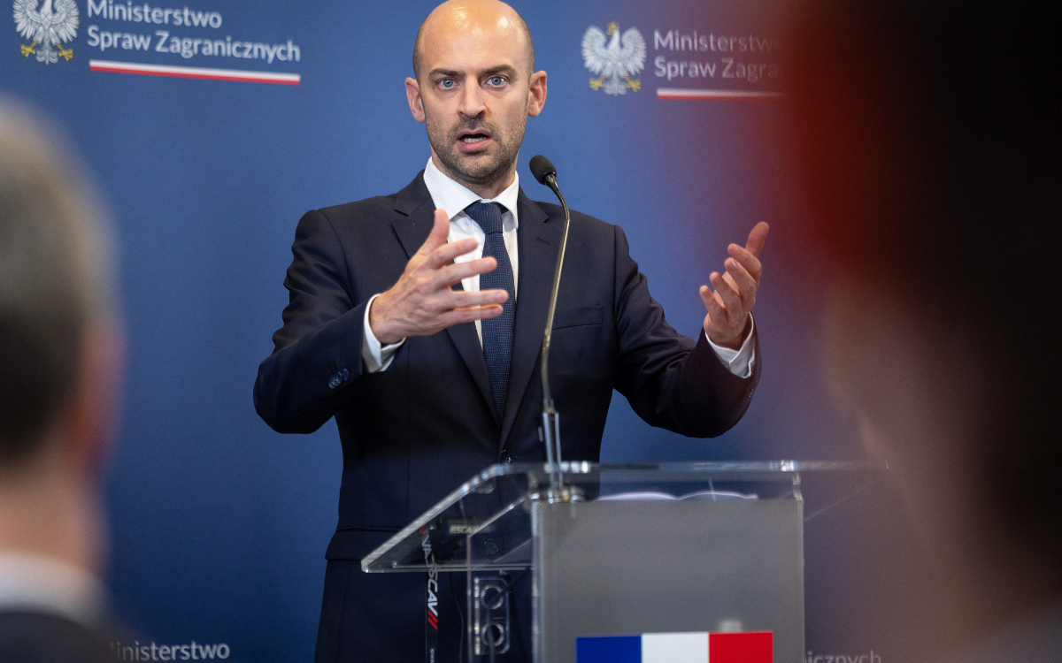 France’s foreign minister Jean-Noel Barrot talking during a press conference at a desk with the French flag on it