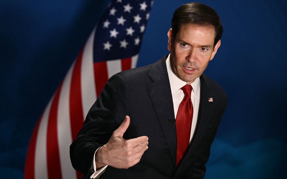 US Secretary of State Marco Rubio speaking in front of the U.S. flag