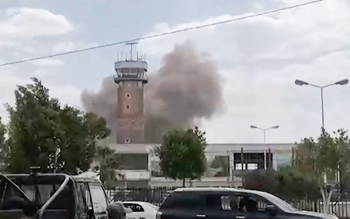 Smoke can be seen in the sky after bombing at the Sanaa airport in Yemen