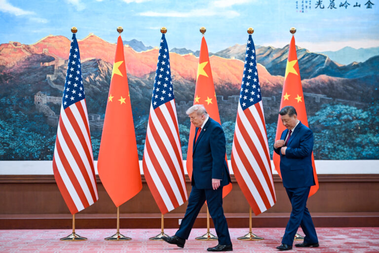 China's President Xi Jinping (R) receives US President Donald Trump after a welcome ceremony at the Great Hall of the People in Beijing