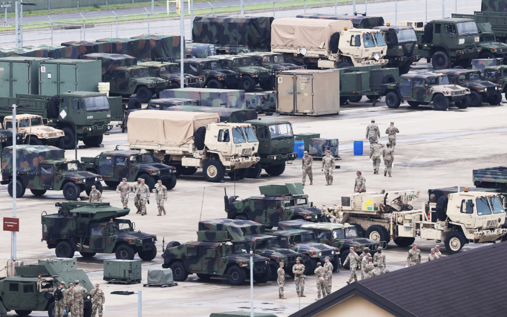 US soldiers are seen near military vehicles at Camp Humphreys in Pyeongtaek on August 17, 2026. South Korea's defence ministry said on August 17, that its joint military exercise with the United States has started after President Donald Trump's announcement it would be scaled back.