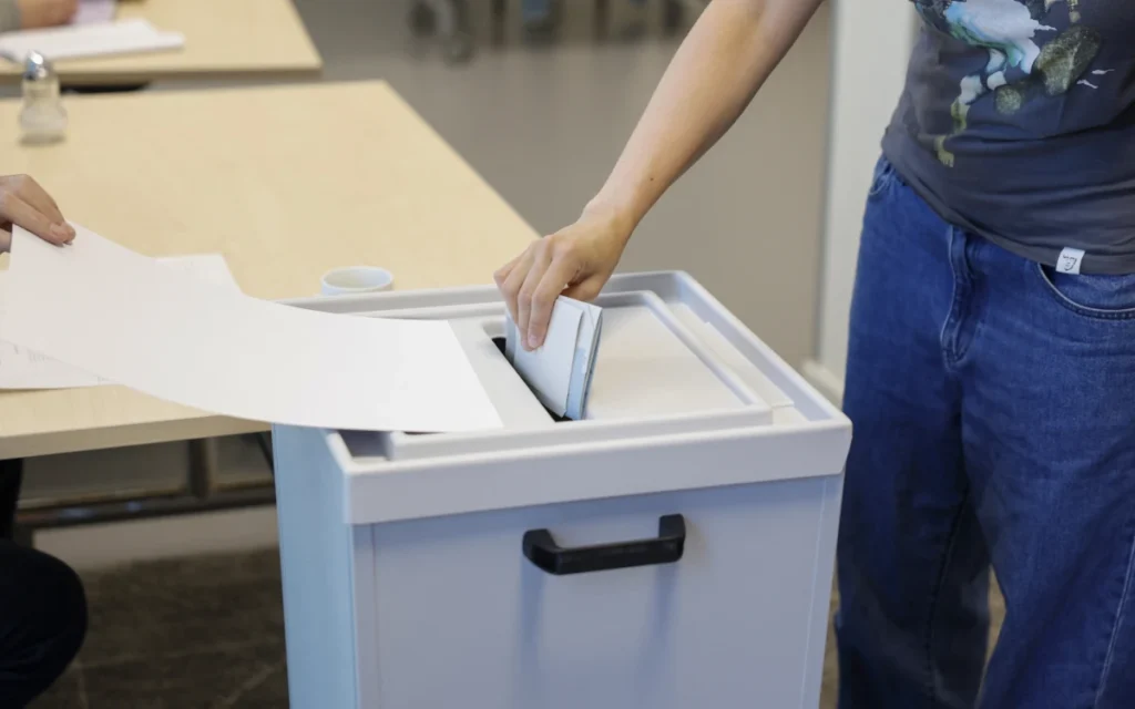 Germans Vote in Elections Threatening Fresh Blow to Merz