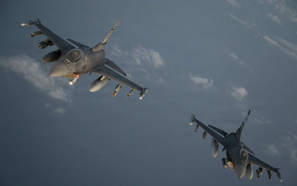 Two US Air Force F-16 fighter jets during patrols in the skies over the Middle East (AFP)